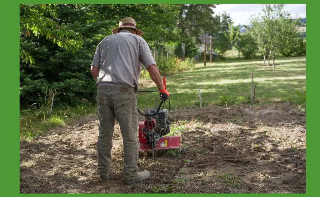 man on tiller working a garden